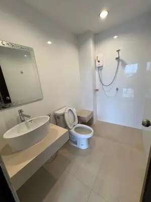 a bathroom with a sink and a toilet and a shower at Rawai Sea Beach in Phuket Town