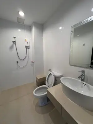 a bathroom with a toilet and a sink and a shower at Rawai Sea Beach in Phuket Town