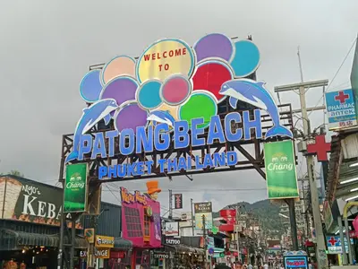 a large sign on a street in a city at STPhostel in Patong Beach
