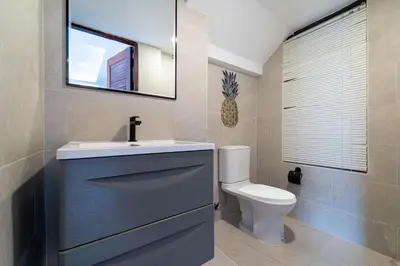a bathroom with a sink and a toilet at Villa Amaya, 2 Story Tropical Oasis with Green Hills View & Pool, Kamala Beach in Kamala Beach