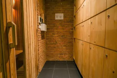 a small hallway with a brick wall and wooden walls at Daimond Exclusive Junior Suite Bangtau Beach in Bang Tao Beach