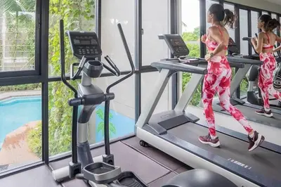 a group of women running on treadmills in a gym at Daimond Exclusive Junior Suite Bangtau Beach in Bang Tao Beach