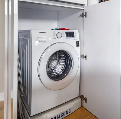 a washer and dryer in a laundry room at Daimond Exclusive Junior Suite Bangtau Beach in Bang Tao Beach