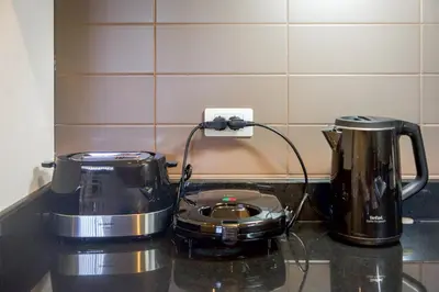 a kitchen counter with a toaster and a coffee maker at Laguna Luxury 2-Bed Pool Villa - Near Layan Beach in Layan Beach