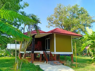a small house with a red roof at Bang Yan Rimlay in Ko Yao Noi