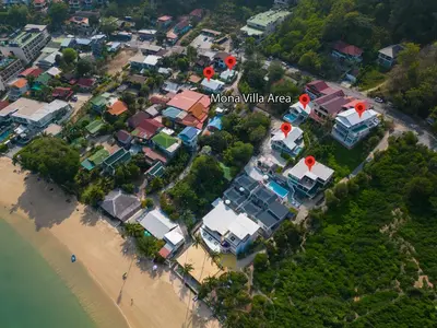 an aerial view of a village next to a beach at mona seaview pool villa beach front AoYon Beach in Panwa Beach