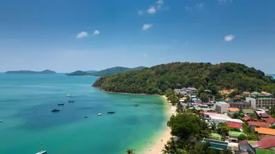 an aerial view of a beach with boats in the water at mona seaview pool villa beach front AoYon Beach in Panwa Beach
