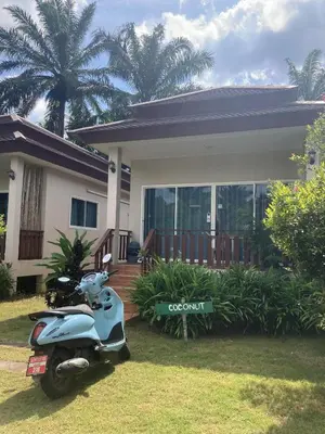 a scooter parked in front of a house at Lay Back Villa C4 in Ban Nong Thale