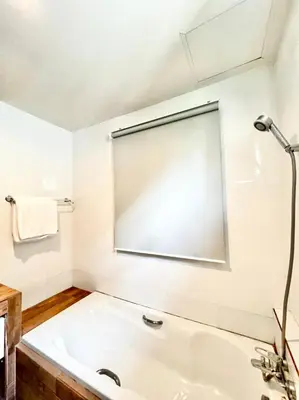 a white bathroom with a tub and a shower at Lay Back Villa C4 in Ban Nong Thale