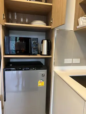 a kitchen with a refrigerator and a microwave at Skypark view golf Laguna Phuket in Bang Tao Beach