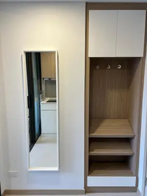 a wardrobe with a mirror in a room at Skypark view golf Laguna Phuket in Bang Tao Beach