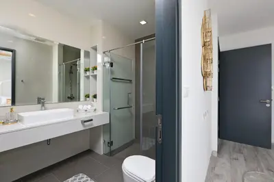 a bathroom with a sink and a shower at Laguna Park 2 in Phuket Town