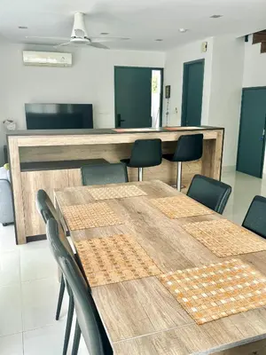 a meeting room with wooden tables and chairs at Laguna Park 2 in Phuket Town