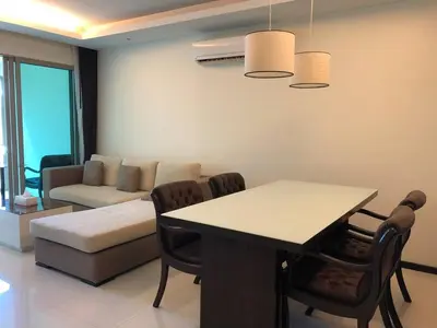 a living room with a table and a couch at Kamala Regent : Beautiful Modern Apartment close to Kamala beach in Kamala Beach