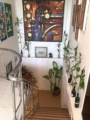 a staircase with plants and a glass ceiling at OASIS 4 or 5 bedroom VILLA in Karon Beach