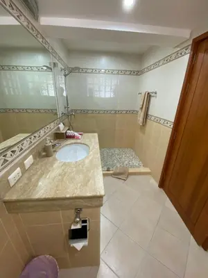 a bathroom with a sink and a shower at Andaman Hill Pool Seaview in Patong Beach