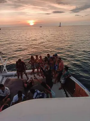 a group of people on a boat in the water at Kata Ocean View Luxury condo & Seaview K12 in Kata Beach