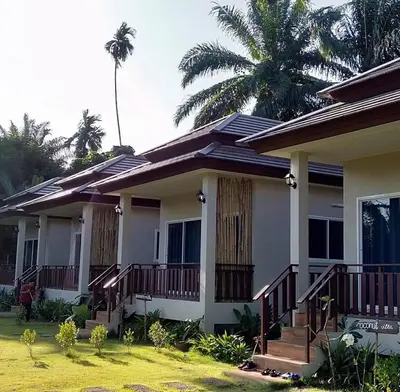 a house with solar panels on the roof at Lay Back Villa C3 with Kitchen & High Speed Internet in Ban Laem Som