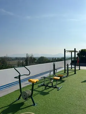 a row of exercise equipment on top of a building at SkyPark Laguna Phuket с террасой in Bang Tao Beach