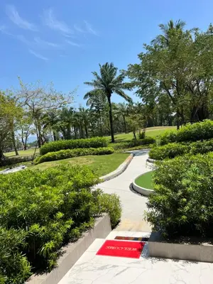 a path in a park with a red carpet at SkyPark Laguna Phuket с террасой in Bang Tao Beach
