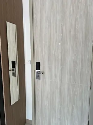 a wooden door with a mirror next to it at SkyPark Laguna Phuket с террасой in Bang Tao Beach