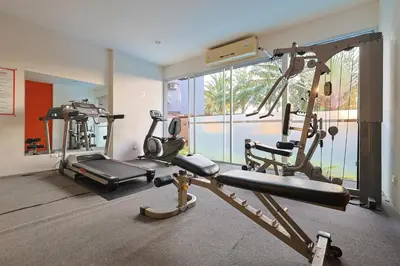 a gym with two tread machines in a room at Sunset Residence Karon Beach in Karon Beach