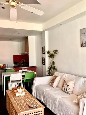a living room with a couch and a table at Patong Beach Side Hotel in Patong Beach