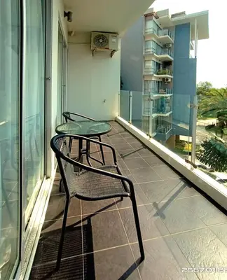 two chairs and a table on a balcony at Апартаменты с видом на море на Карон Бич А 509 in Karon Beach