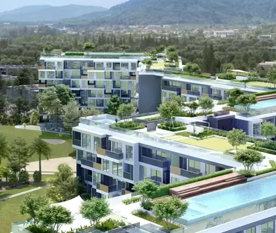 an aerial view of an apartment complex with trees at Апартаменты в Лагуне SkyPark c видом на гольф поле in Bang Tao Beach