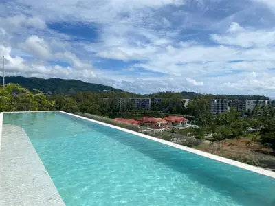 a swimming pool with a view of a city at Апартаменты в Лагуне SkyPark c видом на гольф поле in Bang Tao Beach