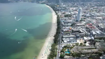 an aerial view of a beach and a city at Issara Patong Beach in Patong Beach