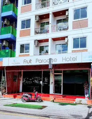 a scooter parked in front of a hotel at \u6c34\u679c\u5929\u5802\u65c5\u9986Fruit Paradise in Patong Beach