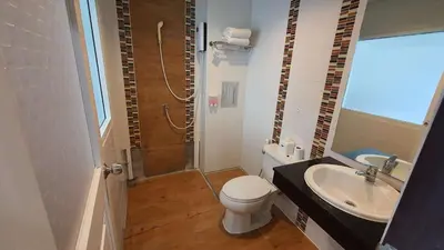 a bathroom with a shower and a toilet and a sink at \u6c34\u679c\u5929\u5802\u65c5\u9986Fruit Paradise in Patong Beach