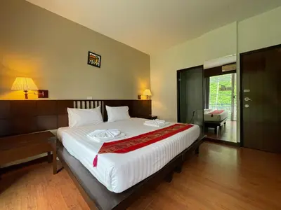 a bedroom with a large bed in a room at Kata Sea Blue in Kata Beach
