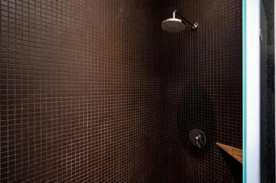 a bathroom with a shower with brown tiled walls at Your Private Paradise - 2BR Tropical Pool Villa Astree in Rawai Beach