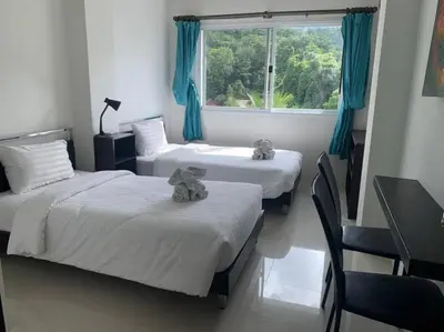 a room with two beds with teddy bears on them at Royal Kamala - Peaceful Private Rooftop Pool Apartment in Kamala in Kamala Beach