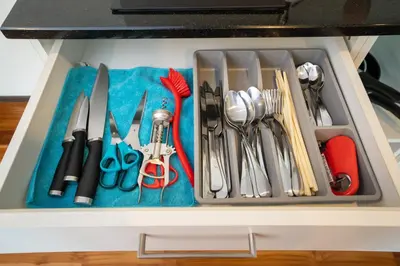 a drawer filled with lots of kitchen utensils at The Title Rawai West Wing Pool View Suite in Rawai Beach