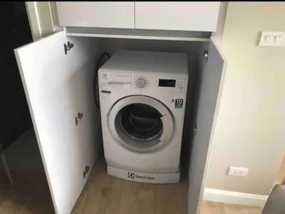 a washer and dryer in a small room at Diamond Apartments Phuket Bangtao in Phuket Town
