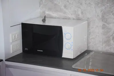 a microwave oven sitting on top of a counter at kalim residence 217 vue partielle mer in Patong Beach