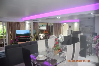 a living room with a couch and a table at kalim residence 217 vue partielle mer in Patong Beach