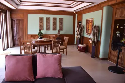 a living room with a couch and a table at VILLA SIRINTHARA in Rawai Beach