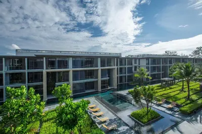 an aerial view of a building with a courtyard at Baan Mai Khao by Villacarte in Mai Khao Beach