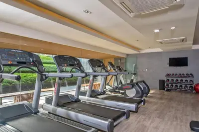 a row of treadmills in a gym at Baan Mai Khao by Villacarte in Mai Khao Beach