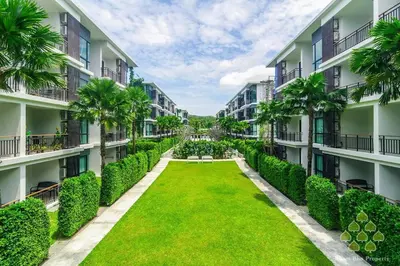 anterior view of the courtyard of an apartment building at Title III and II by Villacarte in Rawai Beach