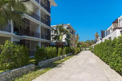 an empty street in front of a building at Title III and II by Villacarte in Rawai Beach
