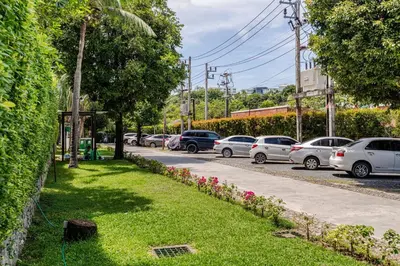 a row of parked cars parked in a parking lot at Title III and II by Villacarte in Rawai Beach