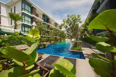a swimming pool in the middle of a building at Title III and II by Villacarte in Rawai Beach