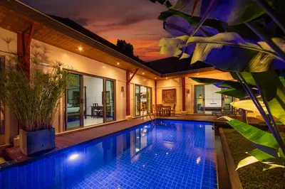 a swimming pool in the backyard of a house at Villa Ikaroa Private pool villa Kokyang Estate in Nai Harn Beach