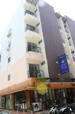 a building with motorcycles parked in front of it at Omaya GuestHouse in Patong Beach