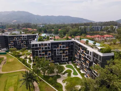 an aerial view of a building with trees and a river at Laguna Skypark by My Home Phuket in Bang Tao Beach